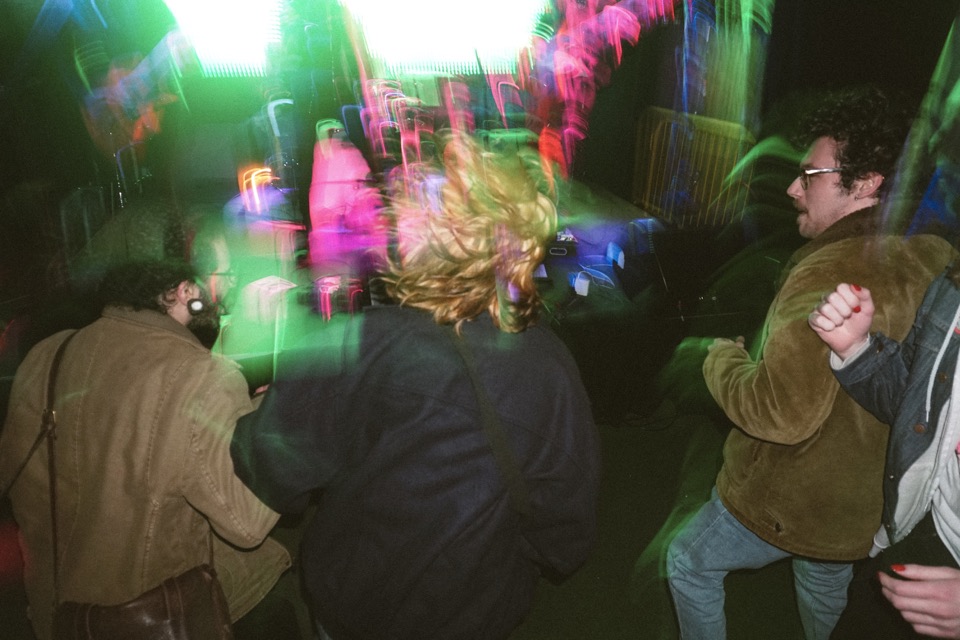 Dancers in motion blur under stage lights