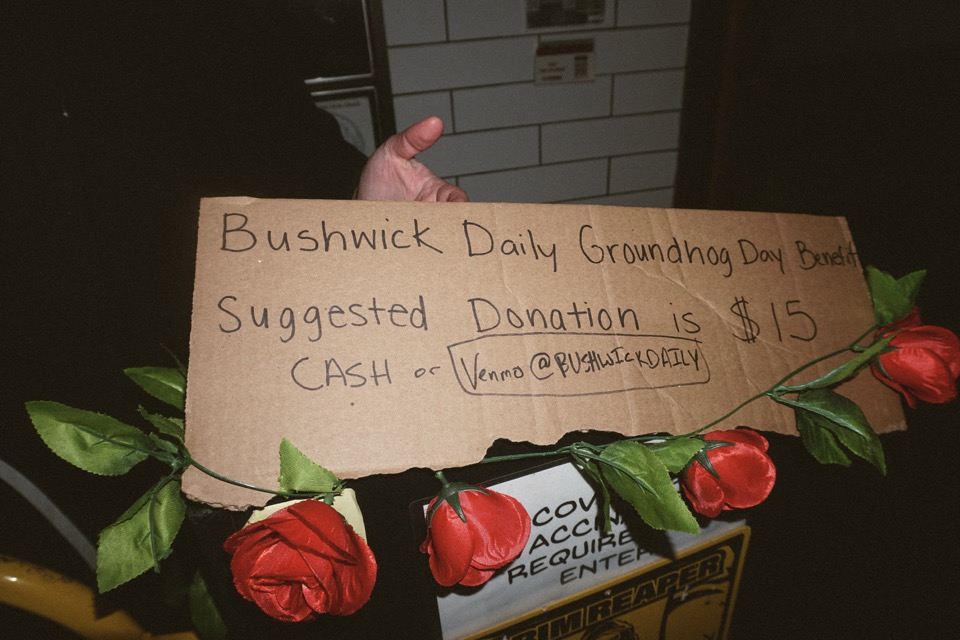 A cardboard sign at the door: Bushwick Daily Groundhog Day Benefit, suggested donation is $15, cash or Venmo