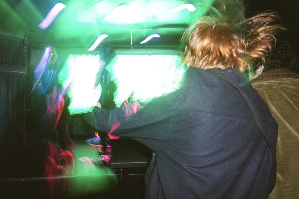 Motion-blurred crowd at the front of the stage