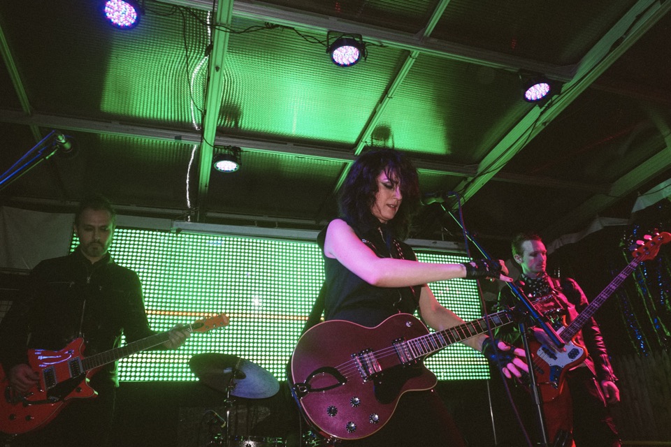 A guitarist and singer on stage